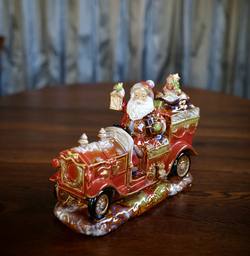 Rustic Ceramic Santa in Car
